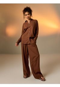 Sinsay - Spodnie wide leg z domieszką lnu - beżowy. Kolor: beżowy