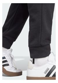 Adidas - adidas Spodnie dresowe Essentials Feel Cozy JE3854 Czarny Regular Fit. Kolor: czarny. Materiał: bawełna #4