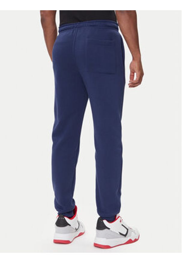 Nike Spodnie dresowe FV7277 410 Granatowy Regular Fit. Kolor: niebieski. Materiał: bawełna