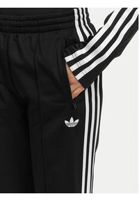 Adidas - adidas Spodnie dresowe Firebird Classic KD5575 Czarny Regular Fit. Kolor: czarny. Materiał: syntetyk #5