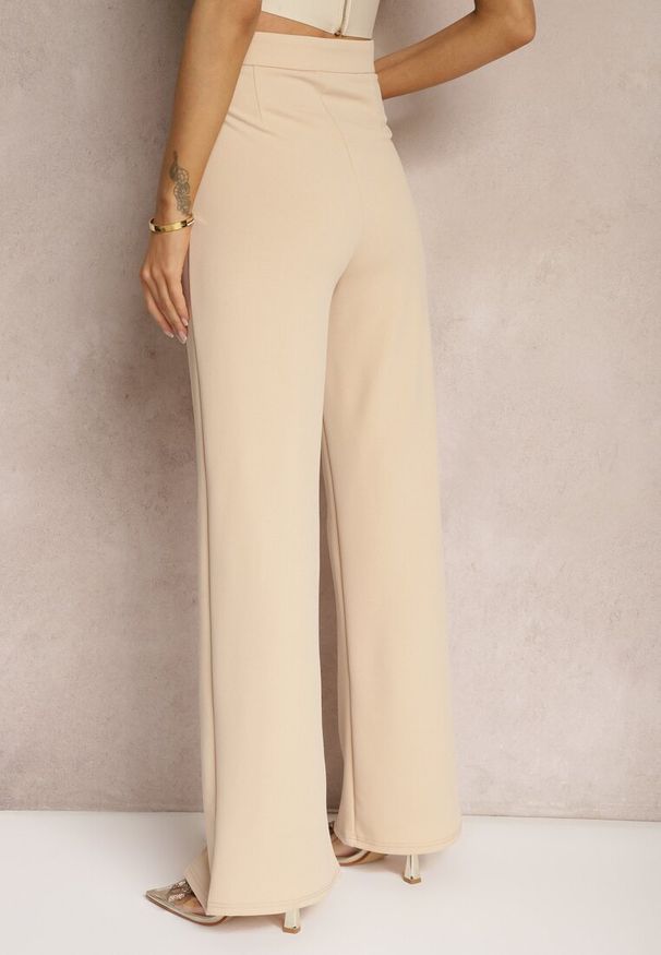 Renee - Beżowe Eleganckie Spodnie High Waist o Szerokim Kroju z Wiskozą i Rozcięciami Yurlea. Okazja: do pracy, na spotkanie biznesowe. Stan: podwyższony. Kolor: beżowy. Materiał: wiskoza. Styl: elegancki