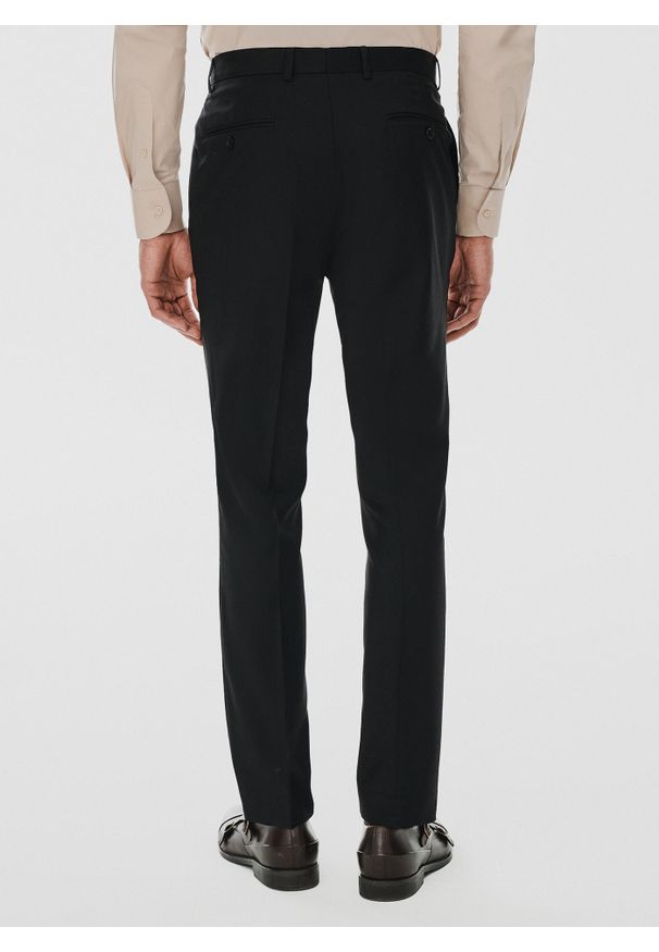 Pako Lorente - PAKO LORENTE – Spodnie garniturowe w kolorze czarnym. Okazja: na spotkanie biznesowe. Kolor: czarny. Materiał: poliester, wiskoza, elastan. Styl: biznesowy, elegancki