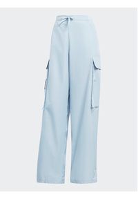 Adidas - adidas Spodnie dresowe City Escape Cargo HZ2874 Błękitny Loose Fit. Kolor: niebieski. Materiał: syntetyk