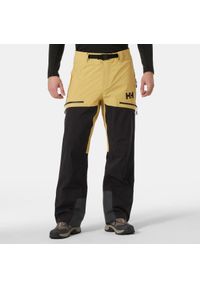 Spodnie narciarskie Helly Hansen Odin BC Infinity Shell. Kolor: żółty, beżowy, wielokolorowy. Sezon: zima. Sport: narciarstwo #1