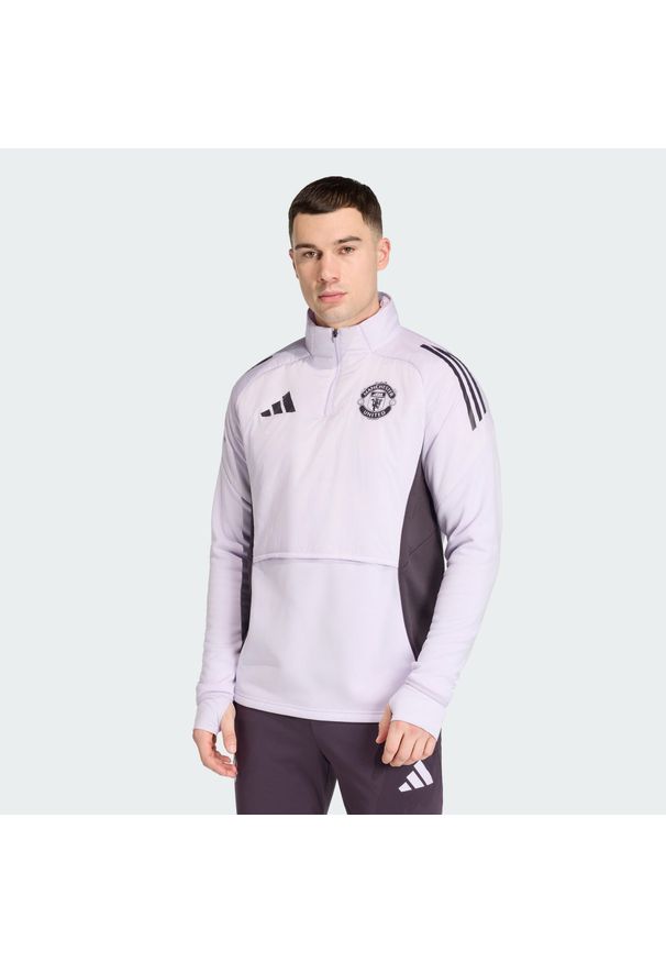 Adidas - Koszulka Manchester United Tiro 25 Competition Winterized. Kolor: fioletowy, wielokolorowy, czarny. Materiał: dresówka. Sport: piłka nożna