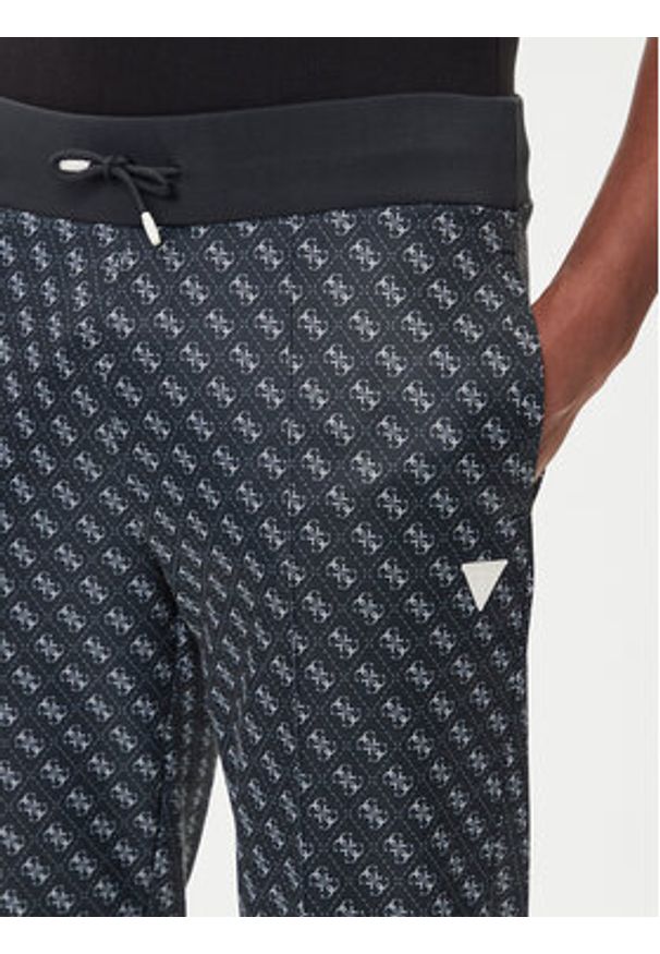 Guess Spodnie dresowe Z2BB05 K7122 Granatowy Regular Fit. Kolor: niebieski. Materiał: syntetyk