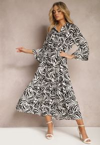 Renee - Czarno-Biała Sukienka Maxi z Falbanką z Guzikami i Liściastym Wzorem Polka. Kolor: czarny. Długość rękawa: długi rękaw. Styl: elegancki. Długość: maxi