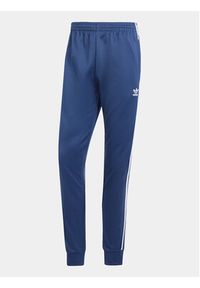Adidas - adidas Spodnie dresowe adicolor Classics SST IR9887 Granatowy Slim Fit. Kolor: niebieski. Materiał: syntetyk, bawełna #6