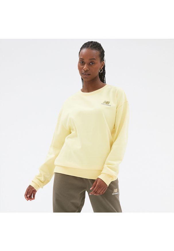 Bluza unisex New Balance UT21501MZ – żółta. Okazja: na co dzień. Kolor: żółty. Materiał: dzianina, materiał, bawełna. Wzór: haft, napisy. Styl: klasyczny, casual