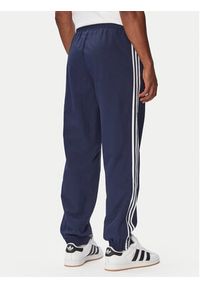 Adidas - adidas Spodnie dresowe Firebird Woven KE1370 Granatowy Regular Fit. Kolor: niebieski. Materiał: syntetyk #5