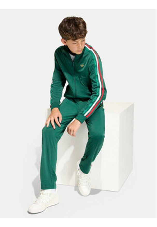 Adidas - adidas Spodnie dresowe Firebird KC9502 Zielony Regular Fit. Kolor: zielony. Materiał: syntetyk