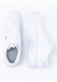 Sneakersy damskie białe Puma Karmen Rebelle. Zapięcie: pasek. Kolor: biały. Materiał: materiał, guma. Szerokość cholewki: normalna. Obcas: na platformie
