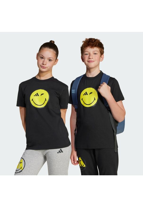 Adidas - Koszulka adidas x Smileyworld Graphics Kids. Kolor: żółty, wielokolorowy, czarny, szary