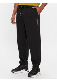 Calvin Klein Spodnie dresowe Grid Logo K10K112430 Czarny Relaxed Fit. Kolor: czarny. Materiał: bawełna
