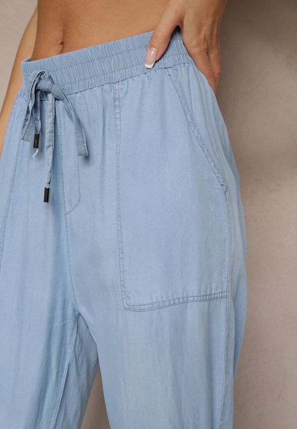 Renee - Niebieskie Spodnie z Bawełną High Waist Ozdobione Wiązaniem Calwia. Okazja: na co dzień. Stan: podwyższony. Kolor: niebieski. Materiał: bawełna. Wzór: aplikacja. Sezon: lato, wiosna. Styl: elegancki, casual