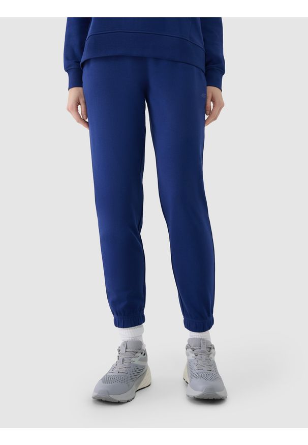 4f - 4F Spodnie dresowe joggery damskie - granatowe XXL. Kolor: niebieski. Materiał: dresówka. Wzór: ze splotem, gładki