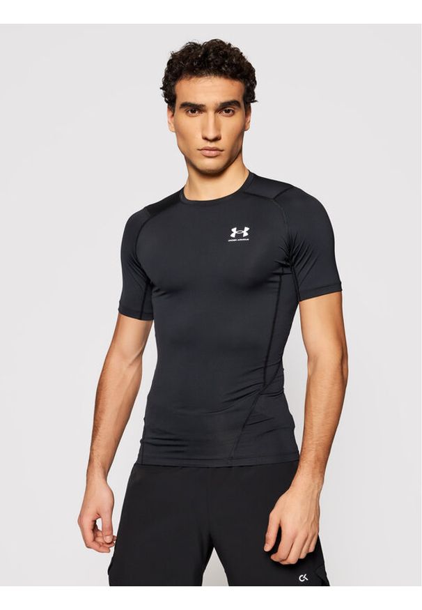 Under Armour Koszulka techniczna Ua HeatGear 1361518 Czarny Slim Fit. Kolor: czarny. Materiał: syntetyk