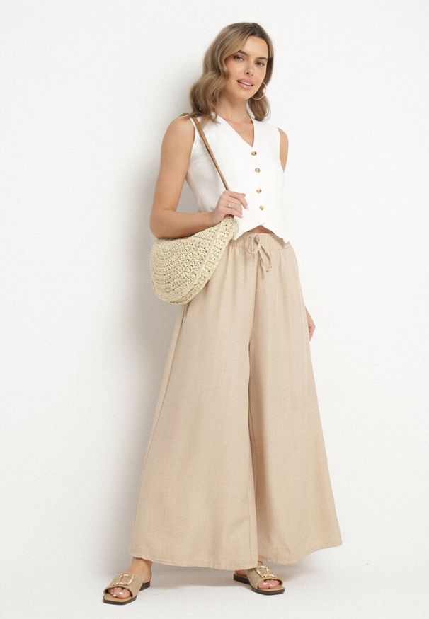 Born2be - Beżowe Spodnie o Szerokim Kroju z Wysokim Stanem i Wiązaniem Telarieta. Okazja: na co dzień. Stan: podwyższony. Kolor: beżowy. Materiał: len. Styl: elegancki, casual, klasyczny