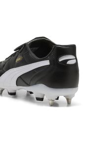 Puma - Buty piłkarskie unisex KING TOP MxSG PUMA Black White Gold. Kolor: czarny, biały, wielokolorowy. Sport: piłka nożna