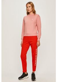 Calvin Klein Jeans - Spodnie. Stan: podwyższony. Kolor: czerwony. Materiał: bawełna, poliester, dzianina. Wzór: nadruk, gładki #2