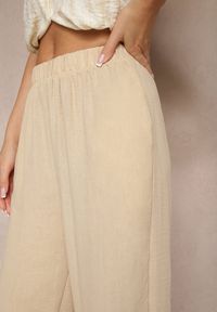 Renee - Beżowe Spodnie Palazzo o Szerokim Kroju High Waist Ollevia. Okazja: na co dzień, na spotkanie biznesowe. Stan: podwyższony. Kolor: beżowy. Materiał: jedwab. Wzór: aplikacja. Styl: biznesowy, elegancki, casual