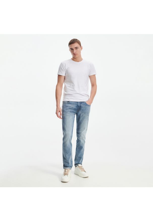 Reserved - Sprane jeansy o kroju slim - Niebieski. Kolor: niebieski