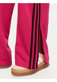 Adidas - adidas Spodnie dresowe Firebird Loose Tracksuit KW0228 Różowy Loose Fit. Kolor: różowy. Materiał: syntetyk #2