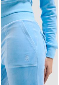 Juicy Couture - JUICY COUTURE Błękitne damskie spodnie dresowe Del Ray Pocketed Pant, Rozmiar M. Kolor: niebieski. Materiał: dresówka