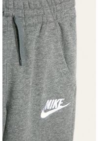 Nike Kids - Spodnie dziecięce 122-170 cm. Kolor: szary. Materiał: materiał, dzianina. Wzór: gładki