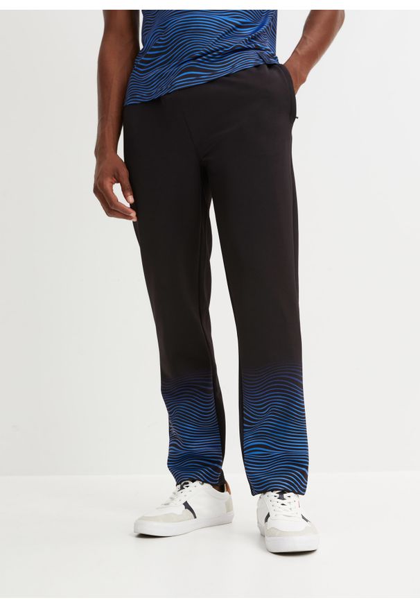 bonprix - Spodnie sportowe. Kolor: czarny. Materiał: materiał. Wzór: nadruk. Styl: sportowy
