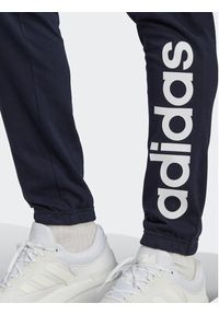 Adidas - adidas Spodnie dresowe Essentials IC0056 Granatowy Regular Fit. Kolor: niebieski. Materiał: bawełna #4