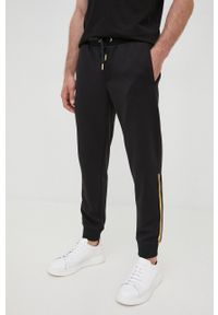 Armani Exchange spodnie dresowe męskie kolor czarny z nadrukiem. Kolor: czarny. Materiał: dresówka. Wzór: nadruk