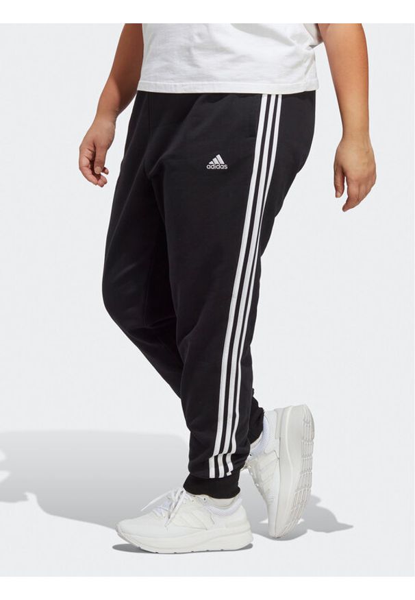 Adidas - adidas Spodnie dresowe Essentials 3-Stripes French Terry Cuffed Joggers (Plus Size) IB8745 Czarny Slim Fit. Kolekcja: plus size. Kolor: czarny. Materiał: bawełna