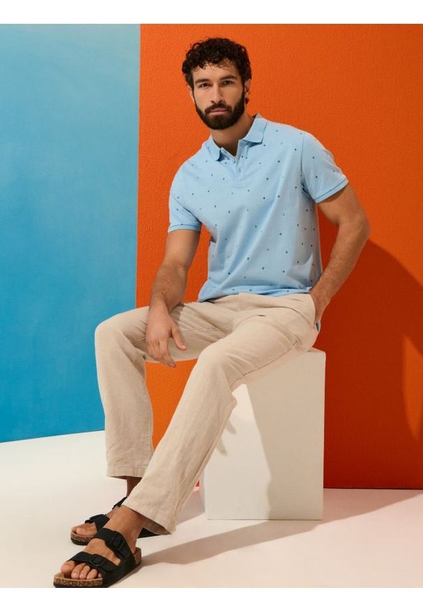 Sinsay - Bawełniana koszulka polo - błękitny. Typ kołnierza: polo. Kolor: niebieski. Materiał: bawełna