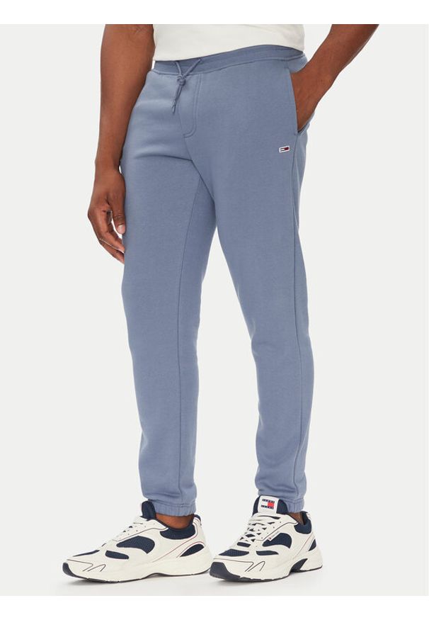 Tommy Jeans Spodnie dresowe Flag DM0DM20473 Niebieski Slim Fit. Kolor: niebieski. Materiał: bawełna
