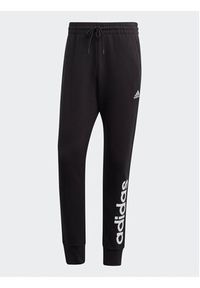 Adidas - adidas Spodnie dresowe Essentials French Terry Tapered Cuff Logo Joggers IC0063 Czarny Regular Fit. Kolor: czarny. Materiał: bawełna #4