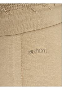 outhorn - Outhorn Spodnie dresowe OTHAW23TTROF478 Beżowy Regular Fit. Kolor: beżowy. Materiał: bawełna