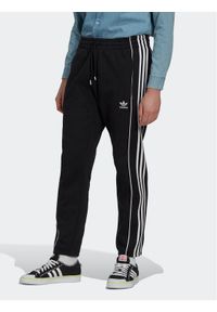 Adidas - adidas Spodnie dresowe Rekive HK7319 Czarny Regular Fit. Kolor: czarny. Materiał: bawełna, dresówka #1