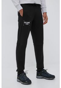 Helly Hansen spodnie dresowe męskie kolor czarny z nadrukiem. Kolor: czarny. Materiał: dresówka. Wzór: nadruk