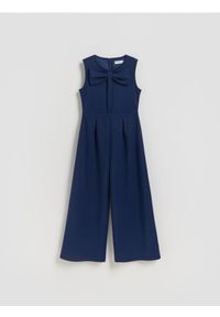 Reserved - Kombinezon z kokardą - granatowy. Typ kołnierza: kokarda. Kolor: niebieski. Materiał: tkanina. Typ sukienki: proste #1