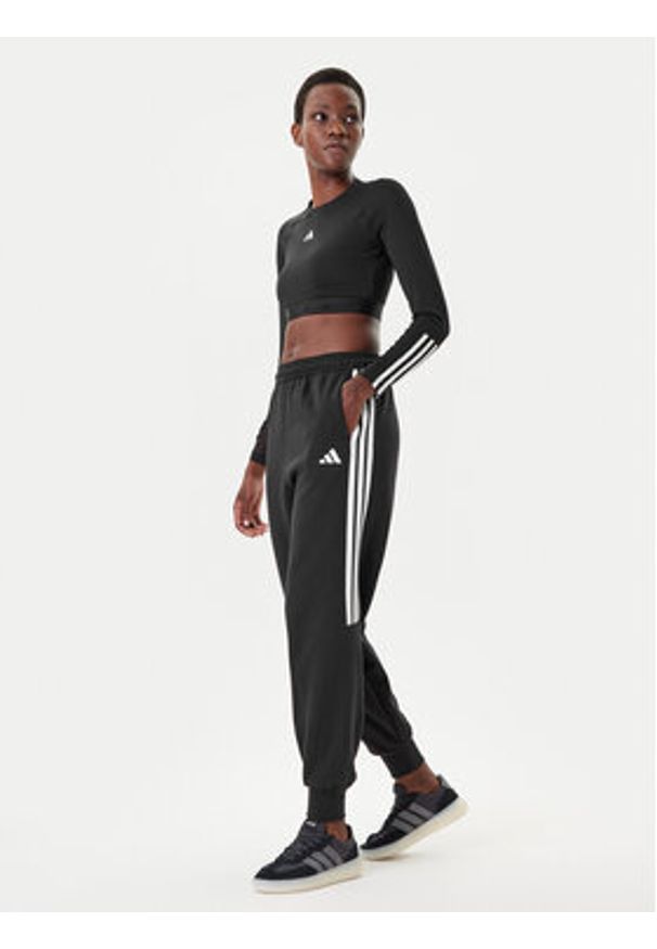 Adidas - adidas Spodnie dresowe Tiro 3-Stripes JL7488 Czarny Loose Fit. Kolor: czarny. Materiał: syntetyk, bawełna