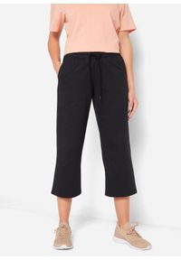 bonprix - Spodnie dresowe z bawełny organicznej, dł. do łydki. Kolor: czarny. Materiał: bawełna, dresówka #1