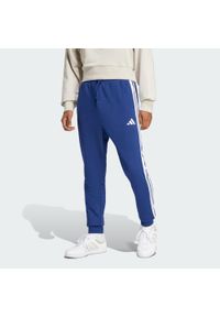 Adidas - Spodnie Essential 3-Stripes French Terry. Kolor: biały, niebieski, wielokolorowy. Materiał: materiał. Sport: fitness