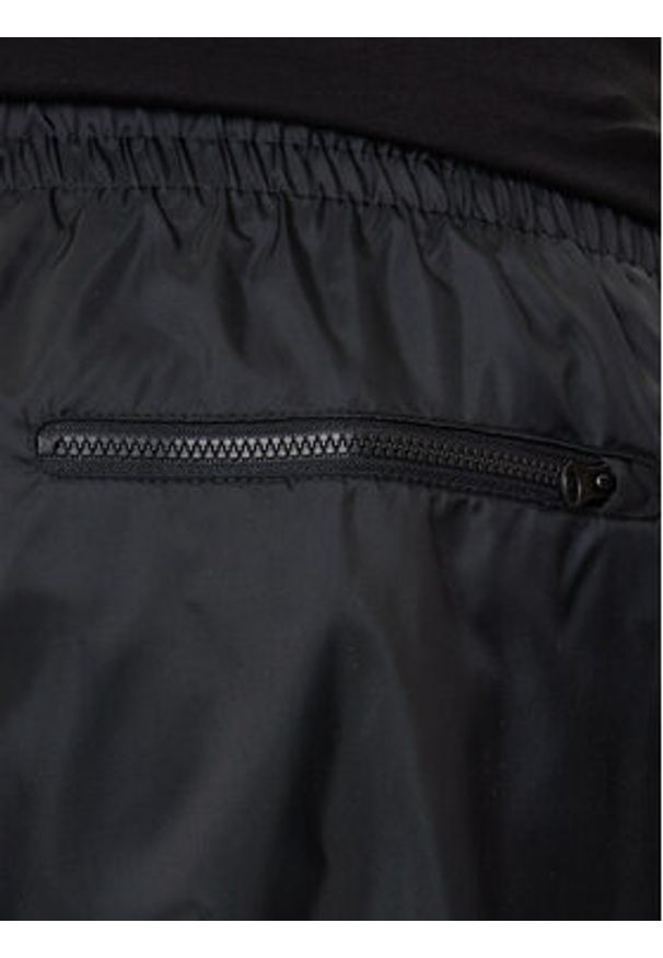 Nike Spodnie dresowe Windrunner DX0653 Czarny Standard Fit. Kolor: czarny. Materiał: syntetyk