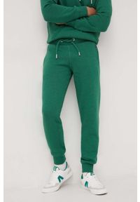 Superdry spodnie dresowe męskie kolor zielony melanżowe. Kolor: zielony. Materiał: dresówka. Wzór: melanż #1
