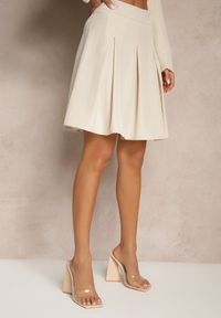 Renee - Beżowa Plisowana Spódnica High Waist o Rozkloszowanym Kroju Redilsa. Stan: podwyższony. Kolor: beżowy. Styl: elegancki