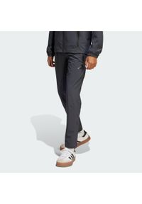 Adidas - Spodnie Arsenal Tiro 25 Competition Vis Tech Travel Kids. Kolor: szary. Materiał: materiał. Sport: piłka nożna #1