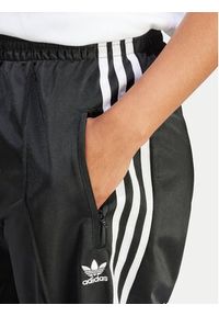 Adidas - adidas Spodnie dresowe Firebird IT7404 Czarny Regular Fit. Kolor: czarny. Materiał: syntetyk #2