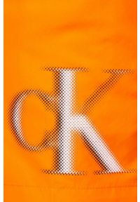 Calvin Klein szorty kąpielowe kolor pomarańczowy. Kolor: pomarańczowy. Materiał: tkanina, poliester, materiał. Wzór: nadruk #3