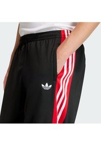 Adidas - adidas Spodnie dresowe KE0117 Czarny Loose Fit. Kolor: czarny. Materiał: syntetyk #7